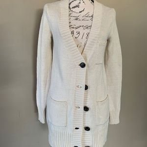 Cream colored cardigan with front pockets